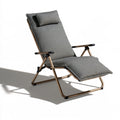 Elvatera gray folding lounge chair with sleek lines, lightweight and adjustable, on a white background.